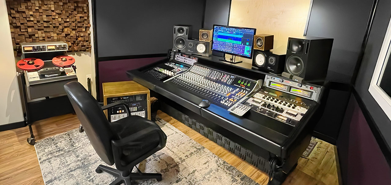 Our control room, featuring our SSL XL-Desk analog mixing console, Ampex ATR-102 tape deck, and custom diffuser. See our Equipment list below.